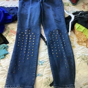 Women’s Allen brand jeans, size 12, with gold brads on both legs for decoration.
